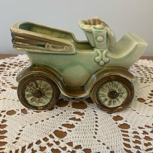 Vintage green antique car planter.